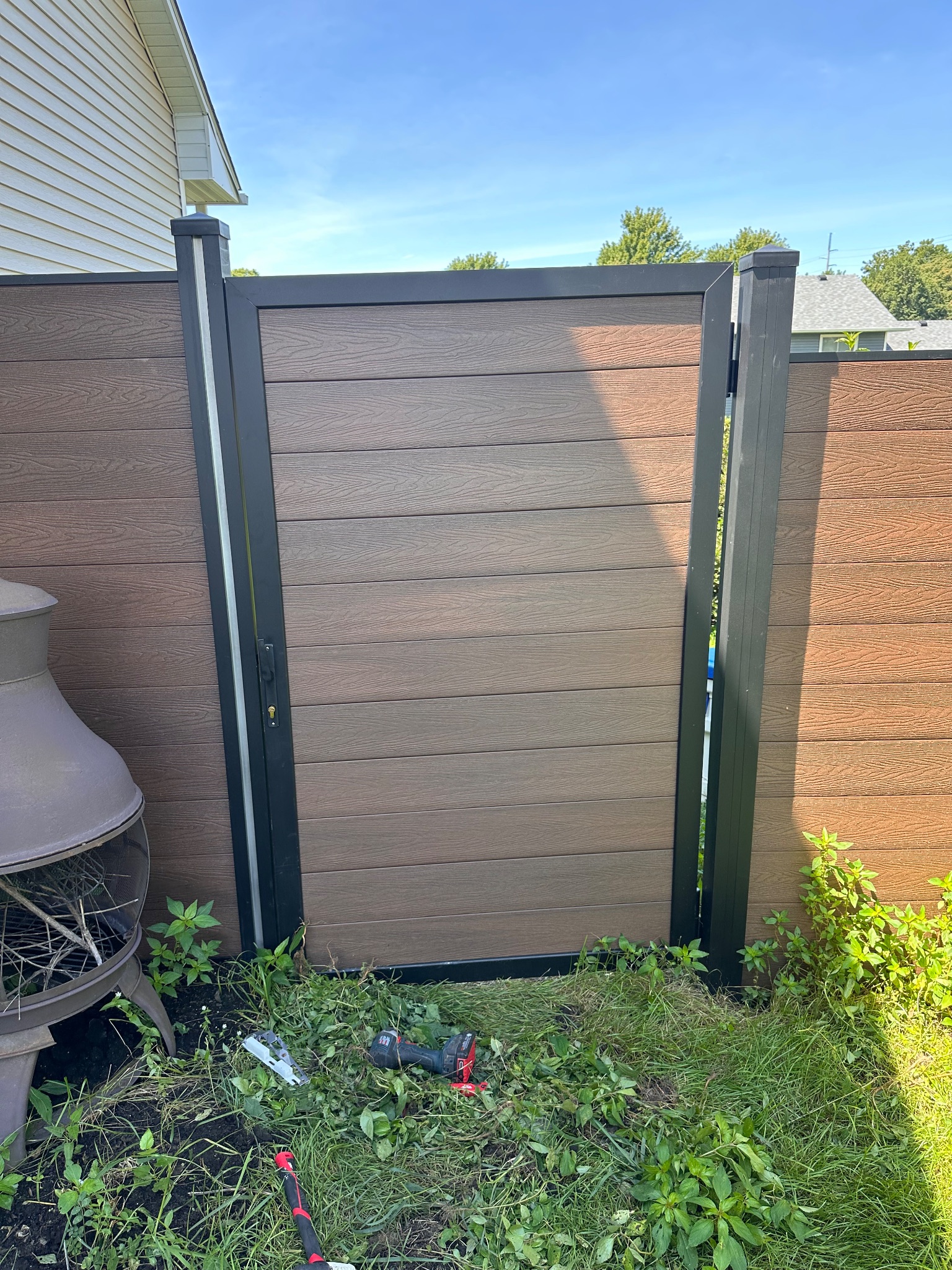 Newly installed composite fence gate in Des Moines, Iowa
