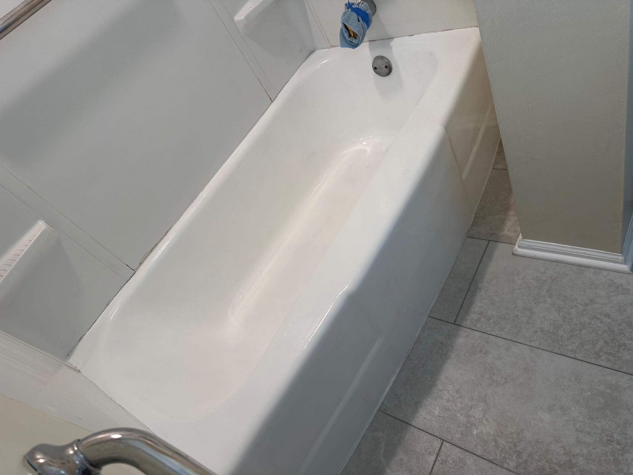 After photo of a newly refinished cast iron bathtub in Des Moines, IA, with a smooth, bright white epoxy coating. Tub Refinishing project.
