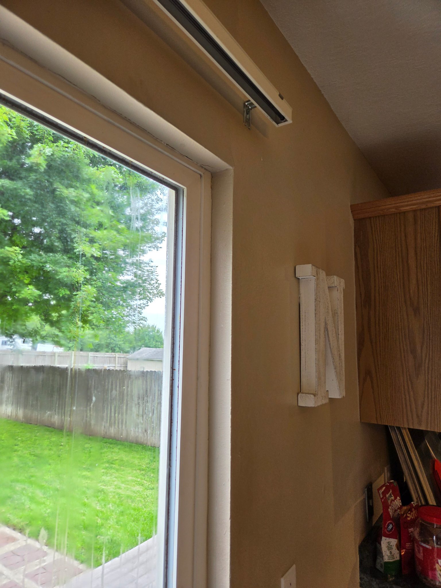 Detail image of new drywall work and trim around a recently installed patio door in Ames, showing a clean, paint-ready finish.