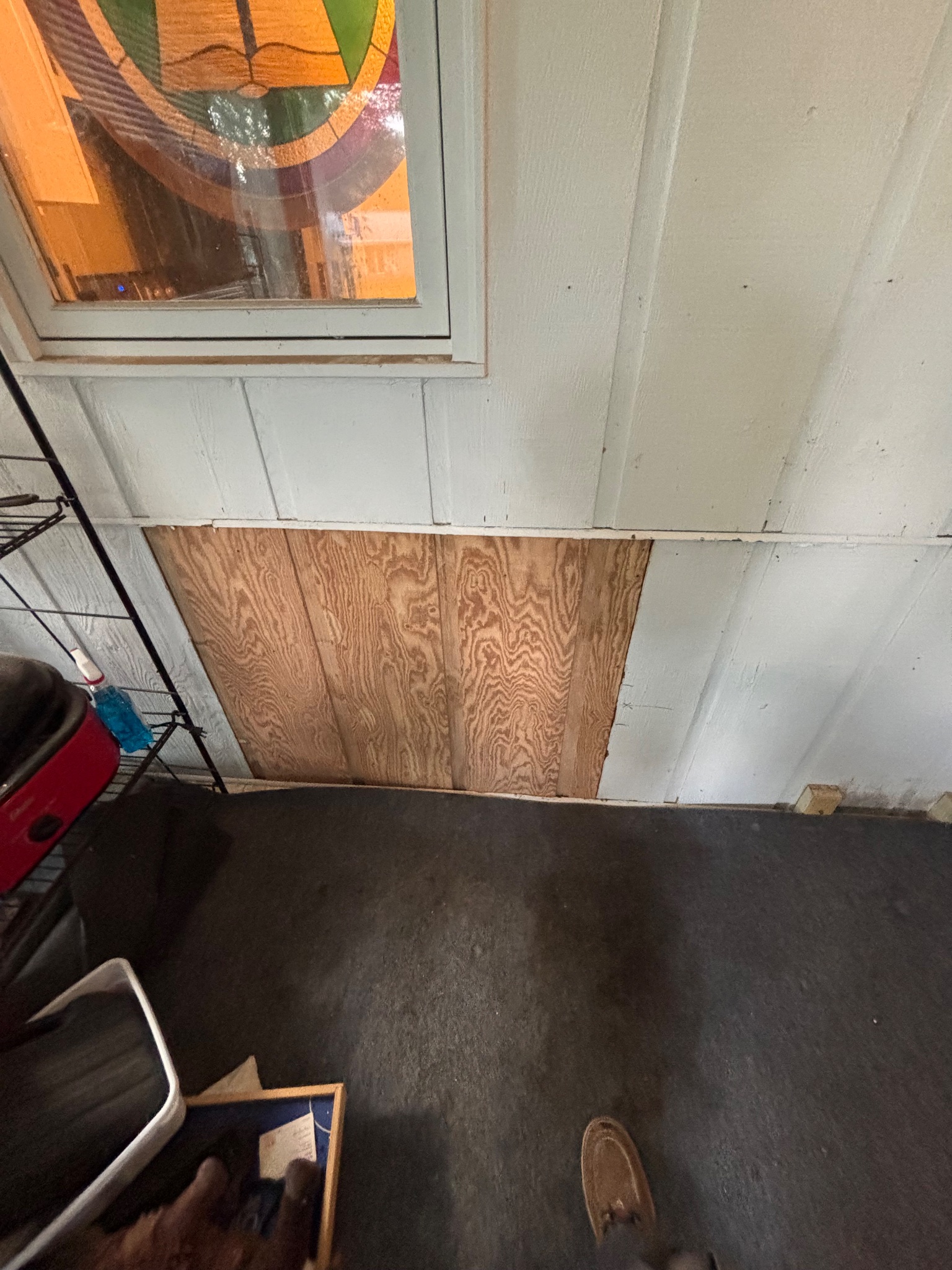 Paneled wall section repaired in Ames, handyman project.