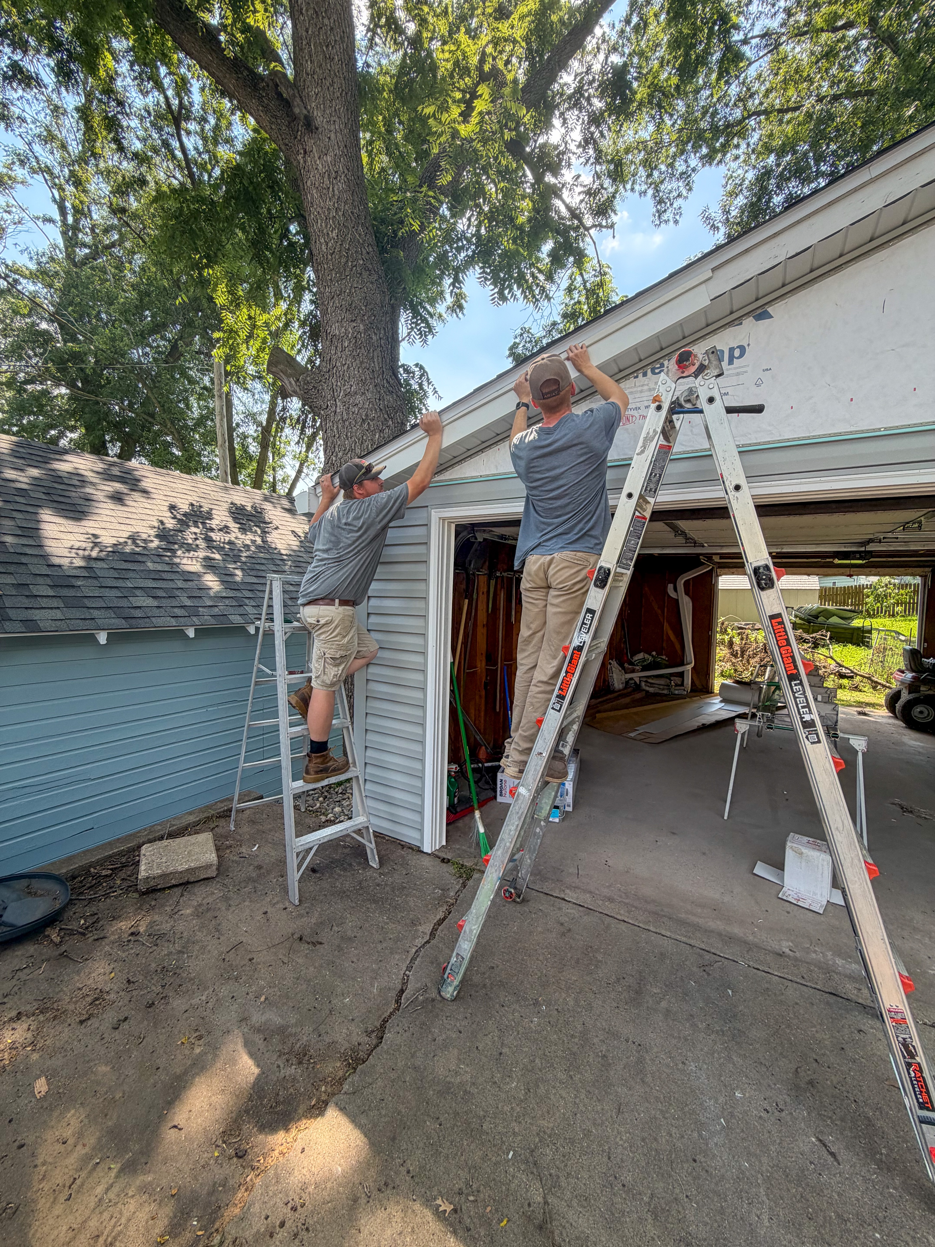 During remodel photo of a garage in Ames with new siding partially installed