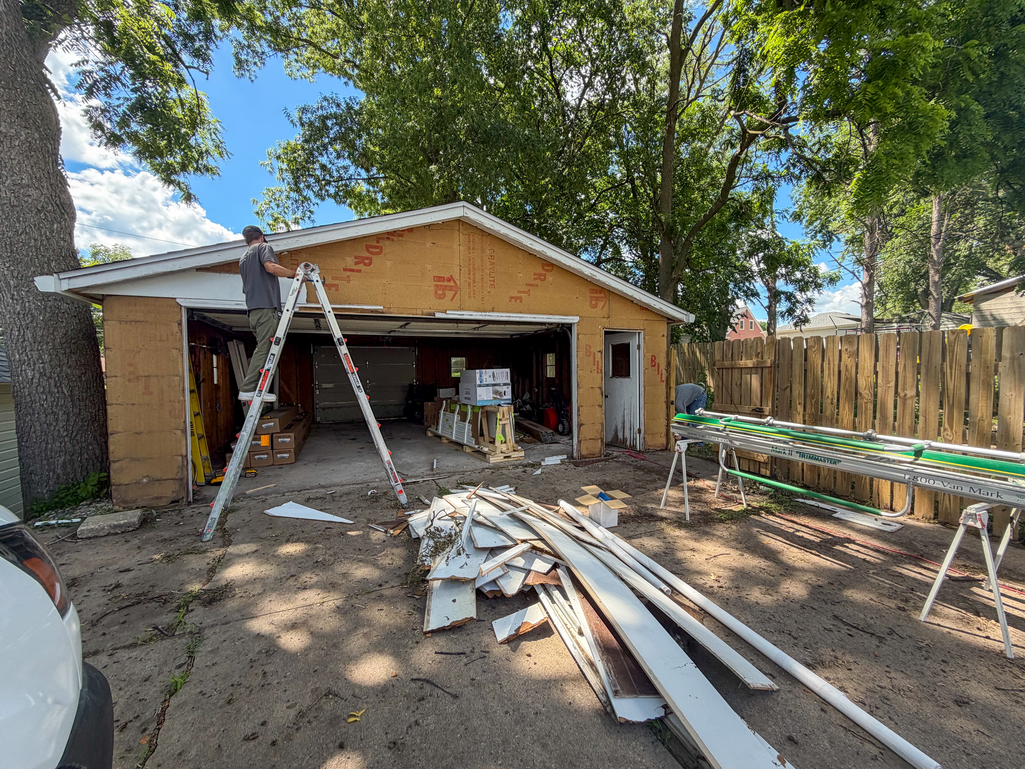 During remodel photo of a garage in Ames, showing the installation of new fascia and soffit