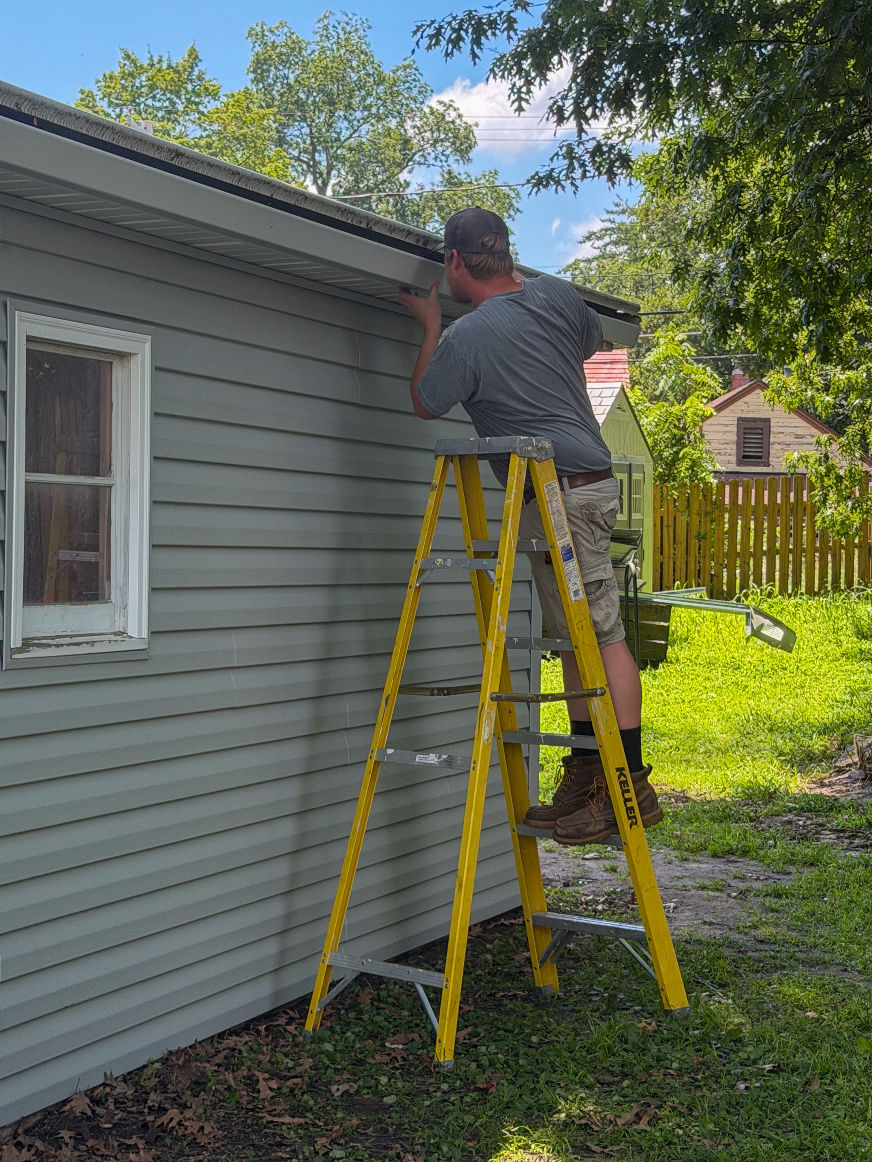 During remodel photo of a garage in Ames with new siding and door frame, before final door installation