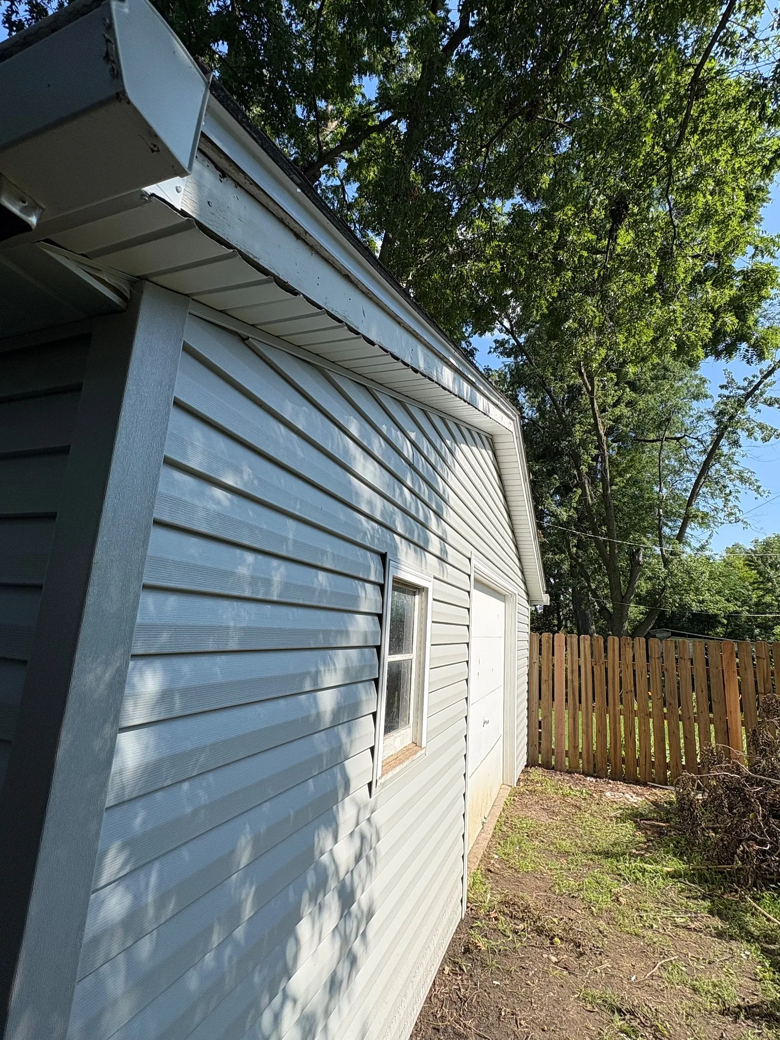 After remodel photo of updated aluminum siding, fascia, and soffit.