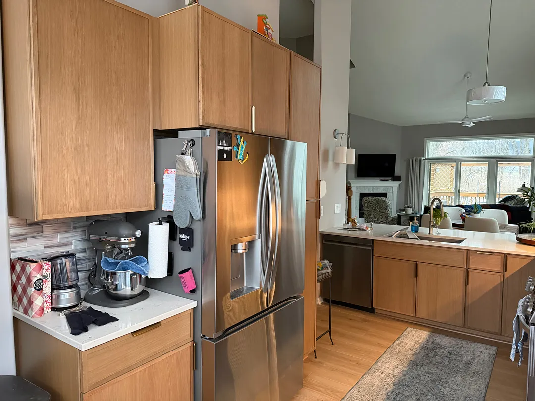 Newly remodeled kitchen with a large island and light-colored cabinetry in Des Moines